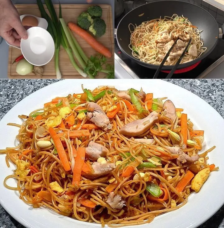 Chinesisch gebratene Nudeln mit Hühnchen, Gemüse und Ei auf einem Teller serviert