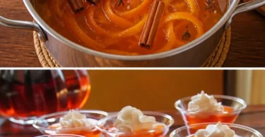 Ein Glas heißer Aperol-Punsch mit Zitrusfrüchten und Gewürzen.