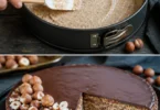 Saftiger Nusskuchen ohne Mehl auf einem Teller, verziert mit Nüssen.